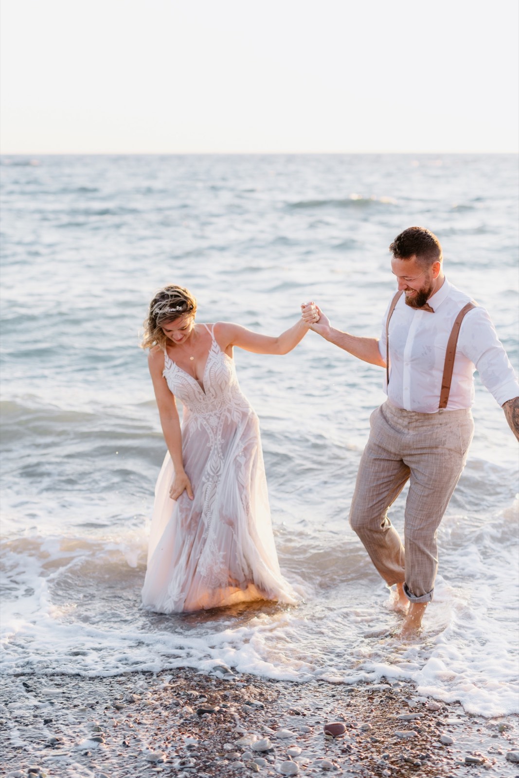 Katie and Dave walking in the Mediterranean at sunset